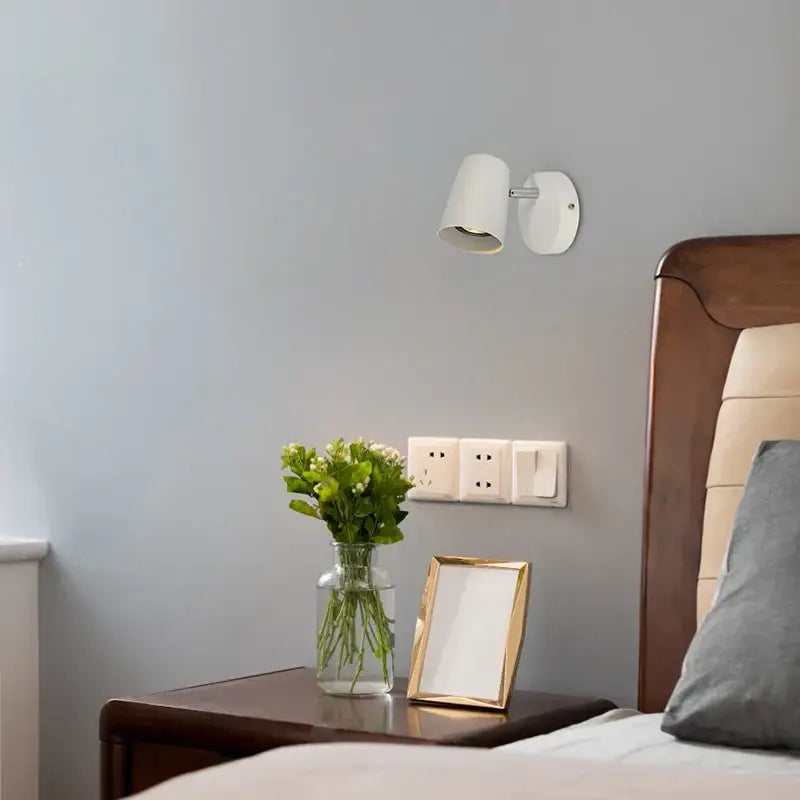 White wall-mounted modern brushed metallic led wall lamp with adjustable spotlight for bedroom reading use