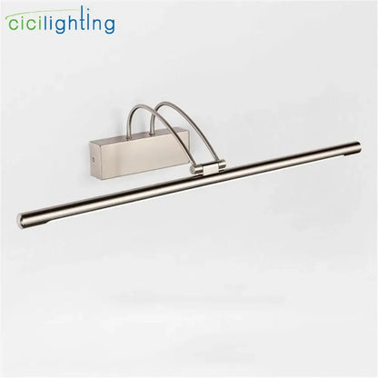 Modern brushed nickel led vanity light with sleek elongated bar and curved arm wall-mounted design for bathroom mirror