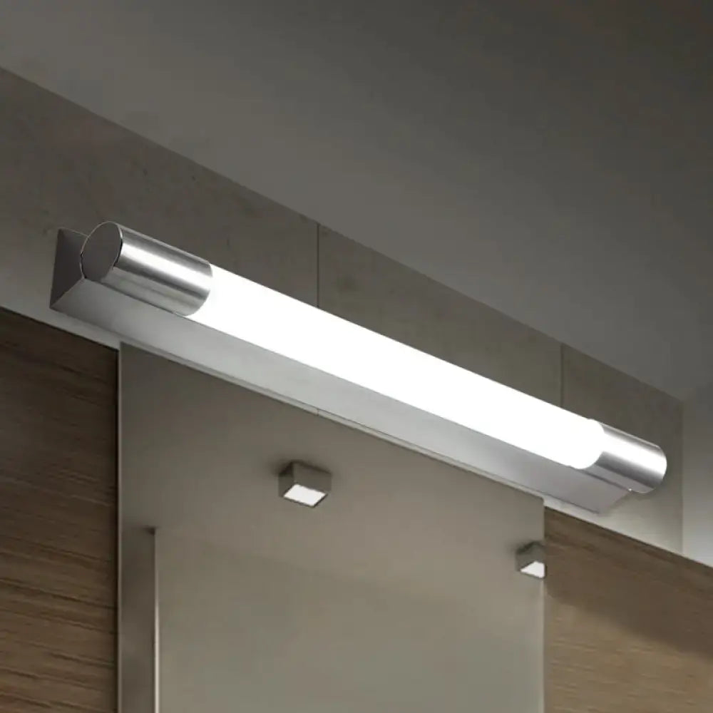 Modern chrome finished led vanity wall light with frosted glass diffuser providing warm white light for bathroom use