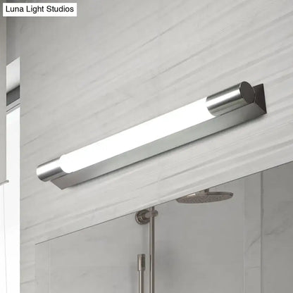 Modern chrome-finished vanity wall light with frosted glass diffuser providing warm white light for bathrooms