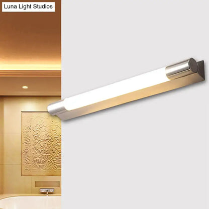 Modern brushed nickel wall light with rectangular design and frosted glass diffuser providing warm white light