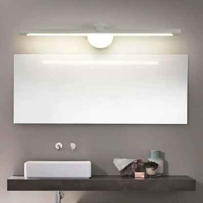 Modern brushed nickel led wall lamp with motion sensor above a sleek white rectangular bathroom mirror with minimalist design