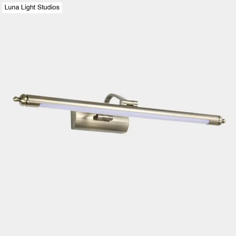 A sleek brushed nickel led wall sconce with integrated led strip providing warm white light for restrooms