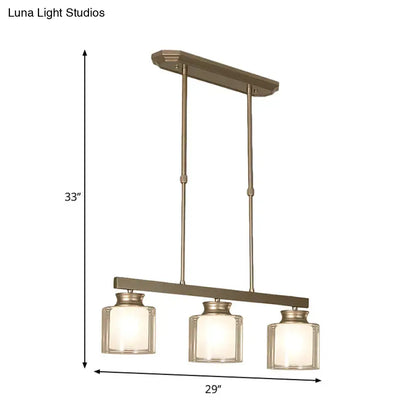 Bronze-finished three-light pendant fixture with clear glass shade from DecorBites traditional gold island lamp