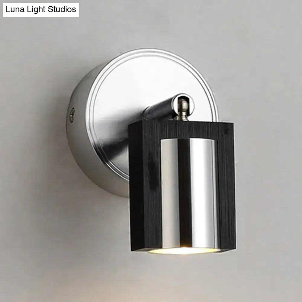 Modern brushed nickel and wood wall sconce with adjustable head metal shade and warm white light for bedroom use
