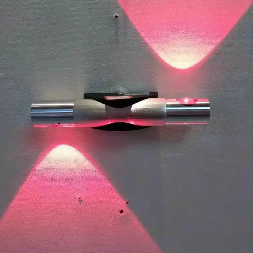 Modern brushed silver led light bedroom sconce with sleek metallic design and two angled pink led beams maximum bulb wattage