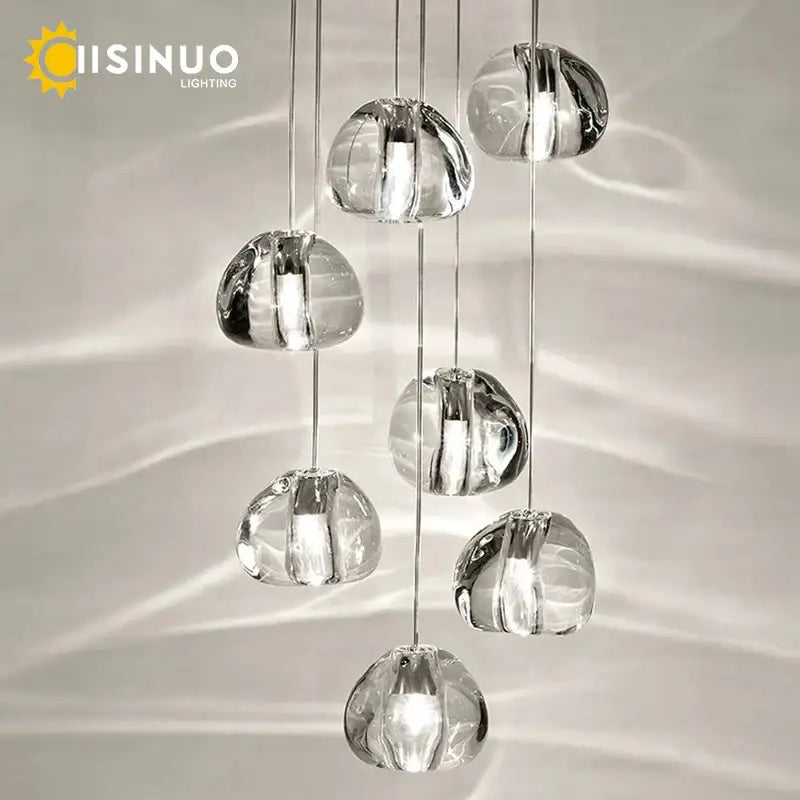 Modern brushed stainless steel pendant light with clear crystal globe cascading design for staircase lighting