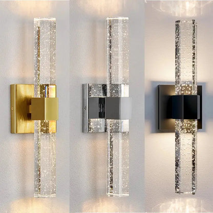 Modern bubble crystal led wall sconces with clear cylindrical glass and metallic gold silver or black mounts for bathroom mirrors