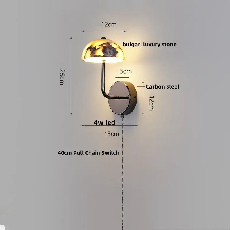 A sleek modern wall light with a dome-shaped alabaster bulgari stone shade and carbon steel arms decorbites bulgari stone