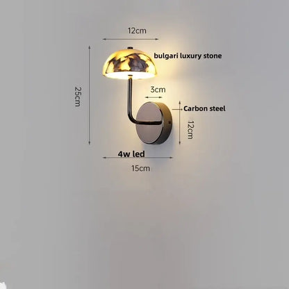 A sleek modern wall light with a polished carbon steel base and bulgari stone led dome shade for bedroom decorbites