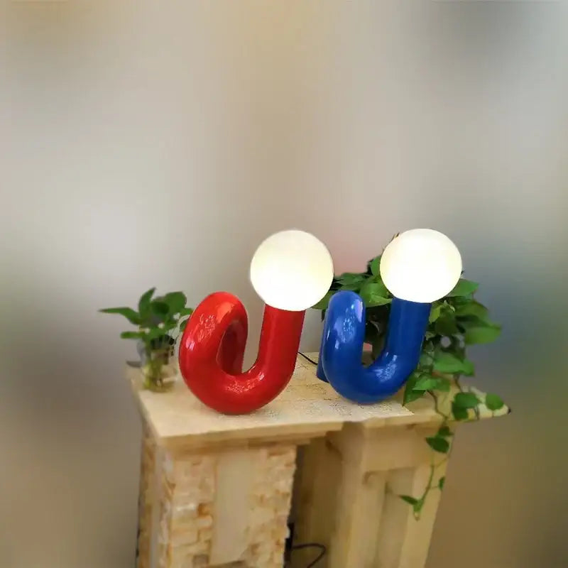 Modern burgundy and white decorbites glass ball table lamp with vibrant red and blue u-shaped glossy design