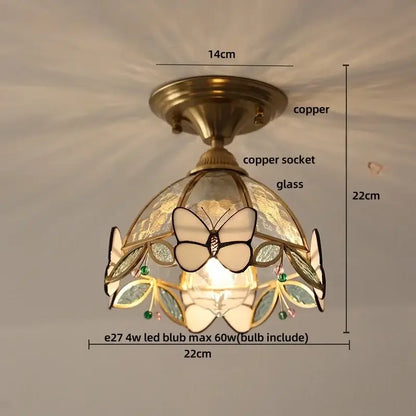 Modern butterfly glass tiffany ceiling light with copper finish and stained glass shade featuring butterfly and green gemstones