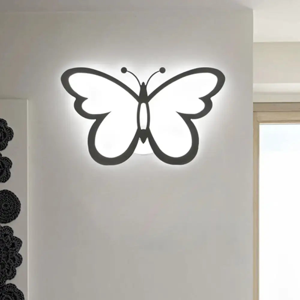 Modern butterfly led wall lamp in black acrylic with glowing white interior featuring maximum bulb wattage for bedroom