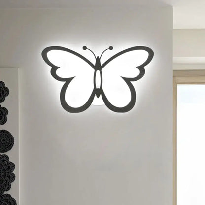 Modern butterfly led wall lamp in black acrylic with glowing white interior featuring maximum bulb wattage for bedroom
