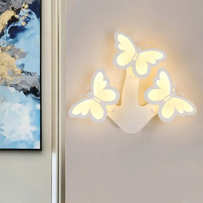 Three-dimensional butterfly shaped modern wall lamp with translucent white acrylic and soft warm glow maximum bulb wattage 6w