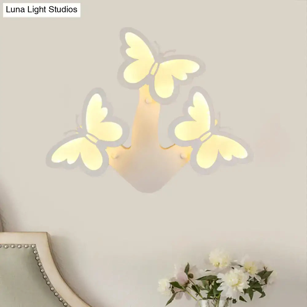 A modern butterfly led wall lamp with acrylic sconce shaped like a hand with yellow butterflies glowing softly with maximum bulb wattage