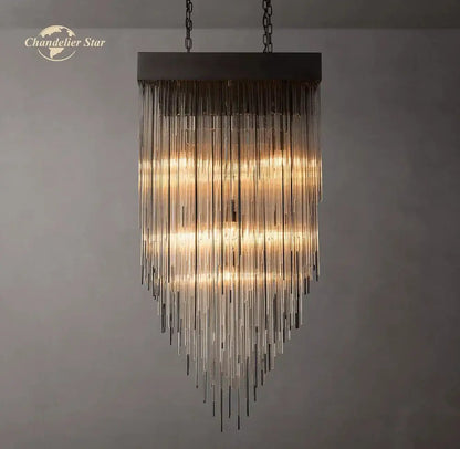 Modern cascada led glass chandelier with dark metal frame and cascading clear tubes creating warm amber light decorbites cascada led