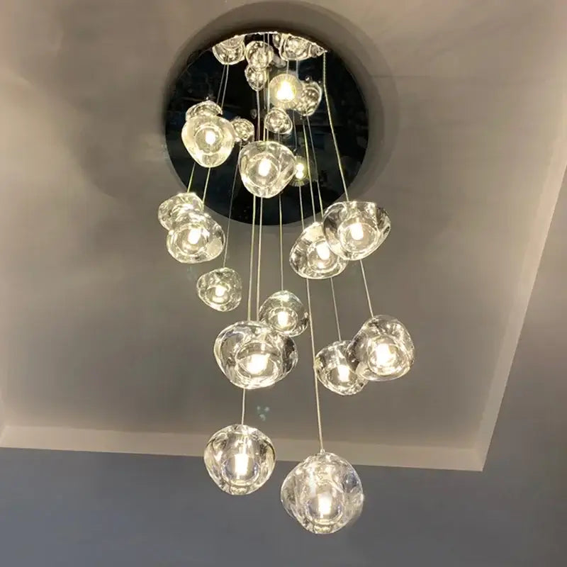 A modern decorbites crystal ball chandelier with clear glass globes suspended from a circular ceiling mount