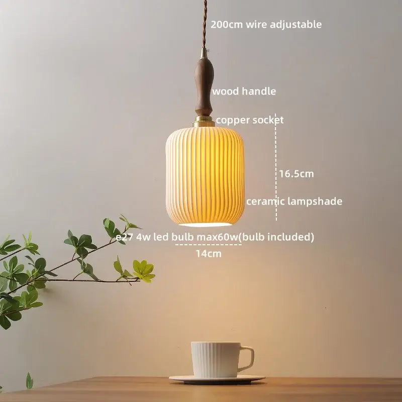 Modern ceramic led pendant light with a warm ribbed off-white ceramic shade, wooden handle, and copper socket for dining room decorbites ceramic led pendant