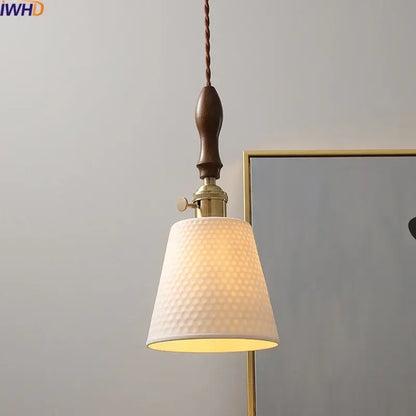 Modern ceramic led pendant light with off-white textured fabric shade, brass hardware, and dark wood handle for dining room decorbites ceramic led pendant