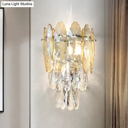 Elegant gold-toned wall sconce with layered amber and clear crystal leaves featuring champagne smoke gray led light design