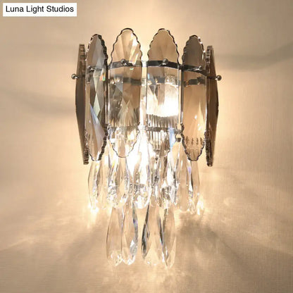 Modern champagne smoke gray crystal wall sconce with faceted glass panels and dangling teardrop crystals led light