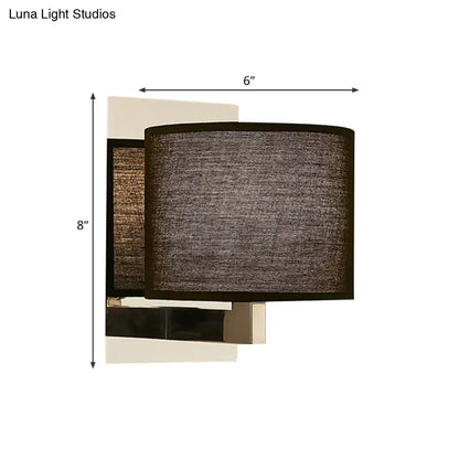 Modern charcoal fabric drum wall sconce with textured dark gray shade and sleek metallic base in white black design