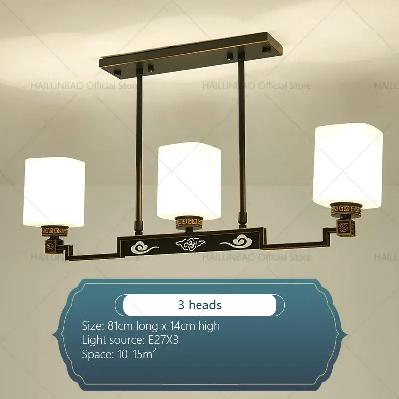 Bronze-finished modern chinese style chandelier pendant light with three white glass shades and ornate cloud motifs