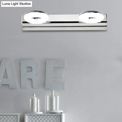 Modern chrome 2 head wall lighting fixture with circular softly glowing bulbs for bathroom wall installation