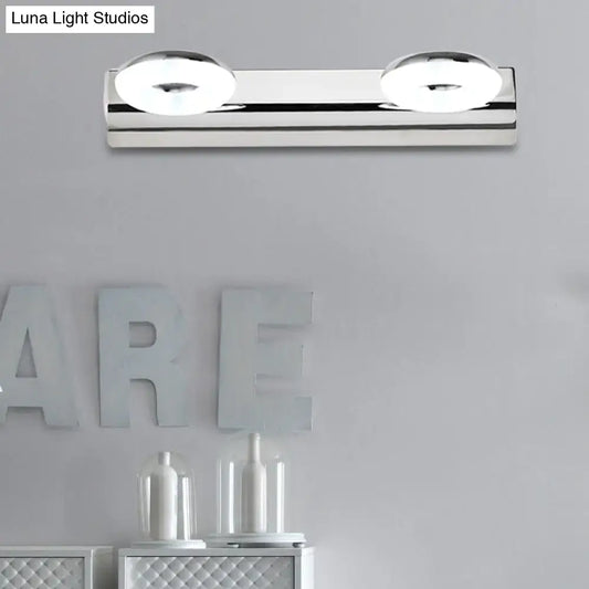 Modern chrome 2 head wall lighting fixture with circular softly glowing bulbs for bathroom wall installation
