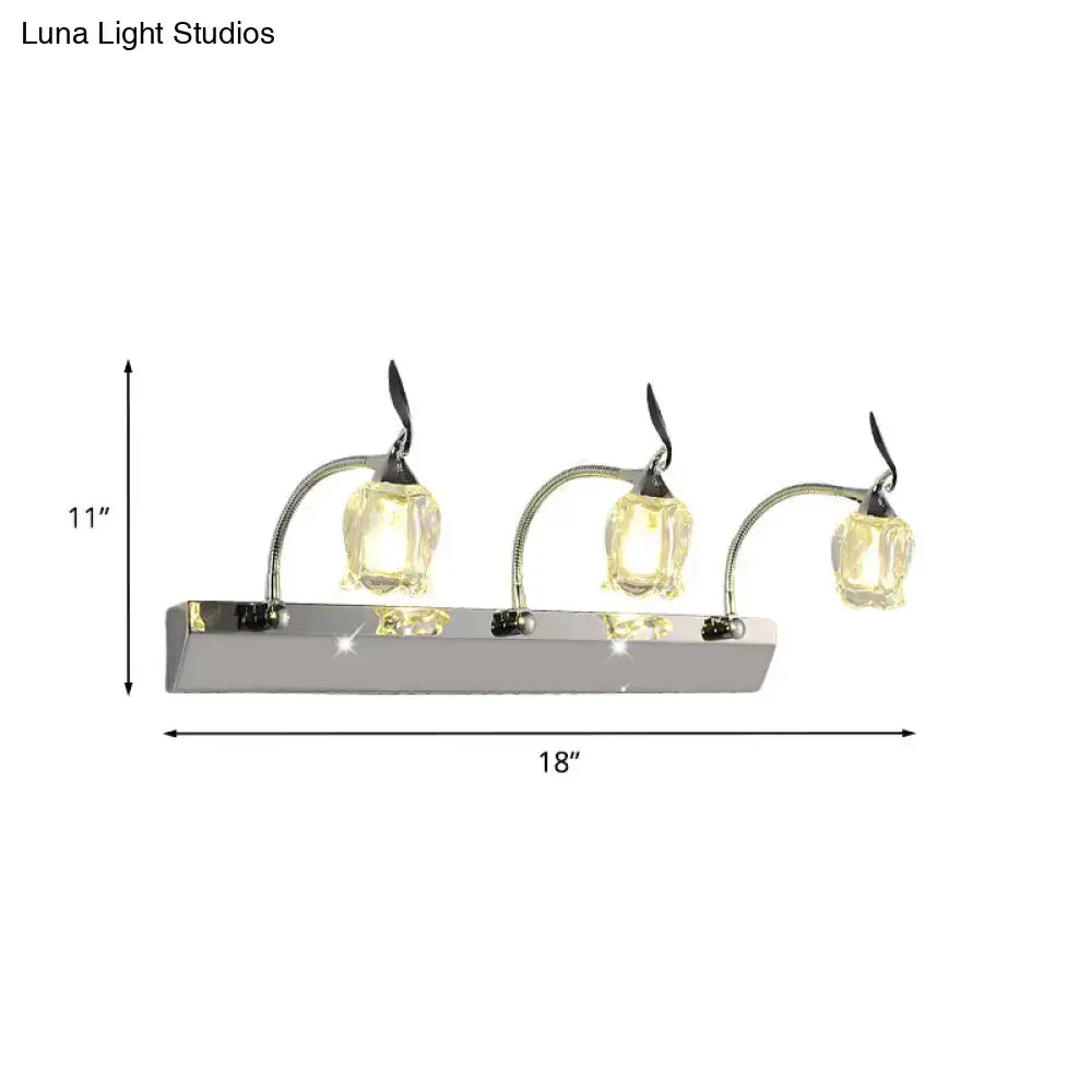 Modern chrome vanity light with three adjustable flower-shaped glass shades emitting warm glow 220v-240v