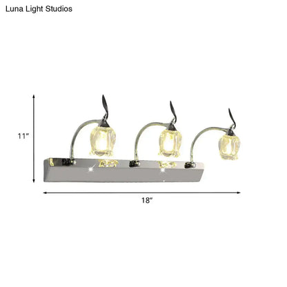 Modern chrome vanity light with three adjustable flower-shaped glass shades emitting warm glow 220v-240v