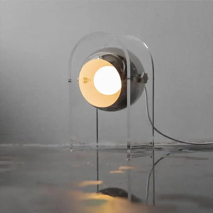 Modern chrome acrylic led desk lamp with spherical chrome head and transparent frame emitting warm light for bedroom decorbites acrylic led