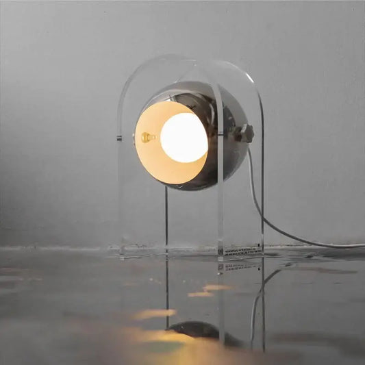 Modern chrome acrylic led desk lamp with spherical chrome head and transparent frame emitting warm light for bedroom decorbites acrylic led