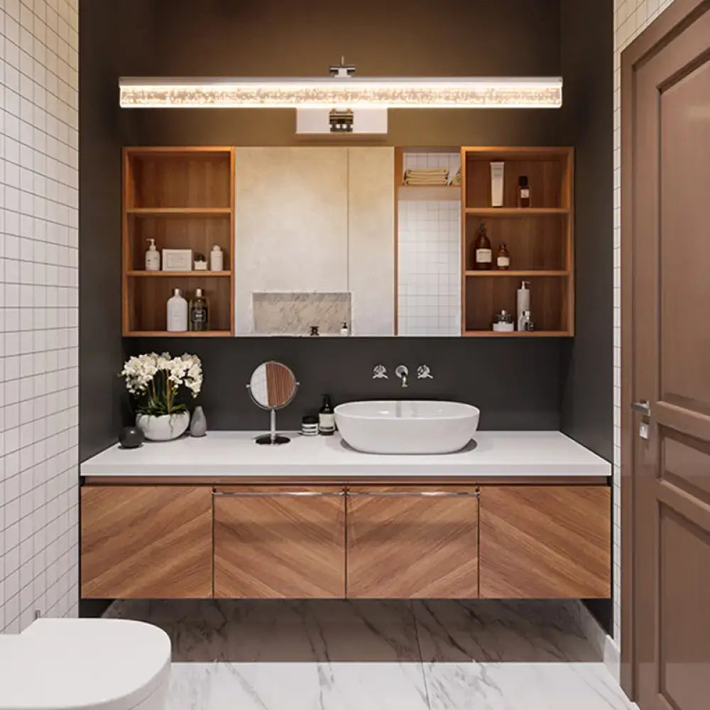 Modern chrome adjustable led vanity light installed above a white oval vessel sink on a wooden chevron vanity light