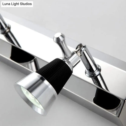 Modern chrome adjustable wall lamp with black ribbed accent band and clear lens spotlight for bathroom use