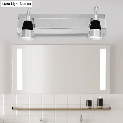 Modern chrome adjustable wall lamp with two black-capped spotlights for bathroom lighting