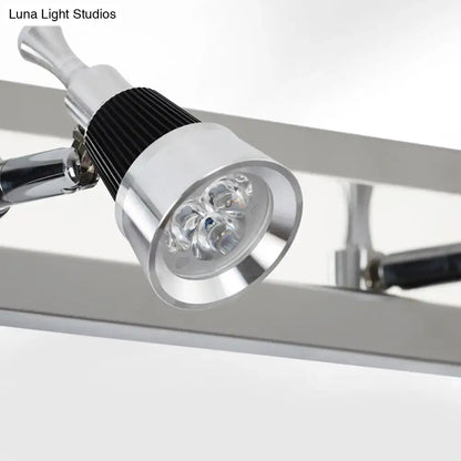Modern chrome adjustable wall lamp with silver and black finish and three bright led bulbs in sleek spotlight design