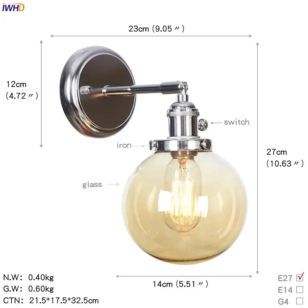 Modern chrome and amber glass ball wall light featuring a chrome iron sconce with a spherical amber glass ball and exposed filament bulb