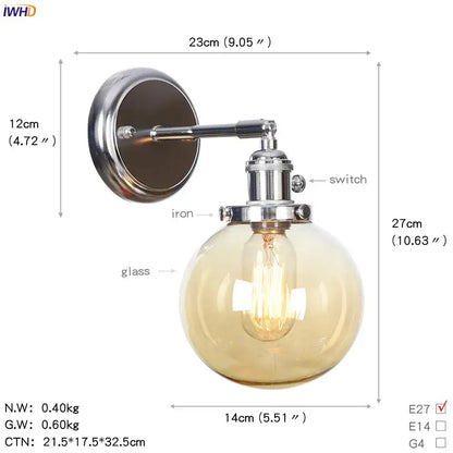 Modern chrome and amber glass ball wall light featuring a chrome iron sconce with a spherical amber glass ball and exposed filament bulb