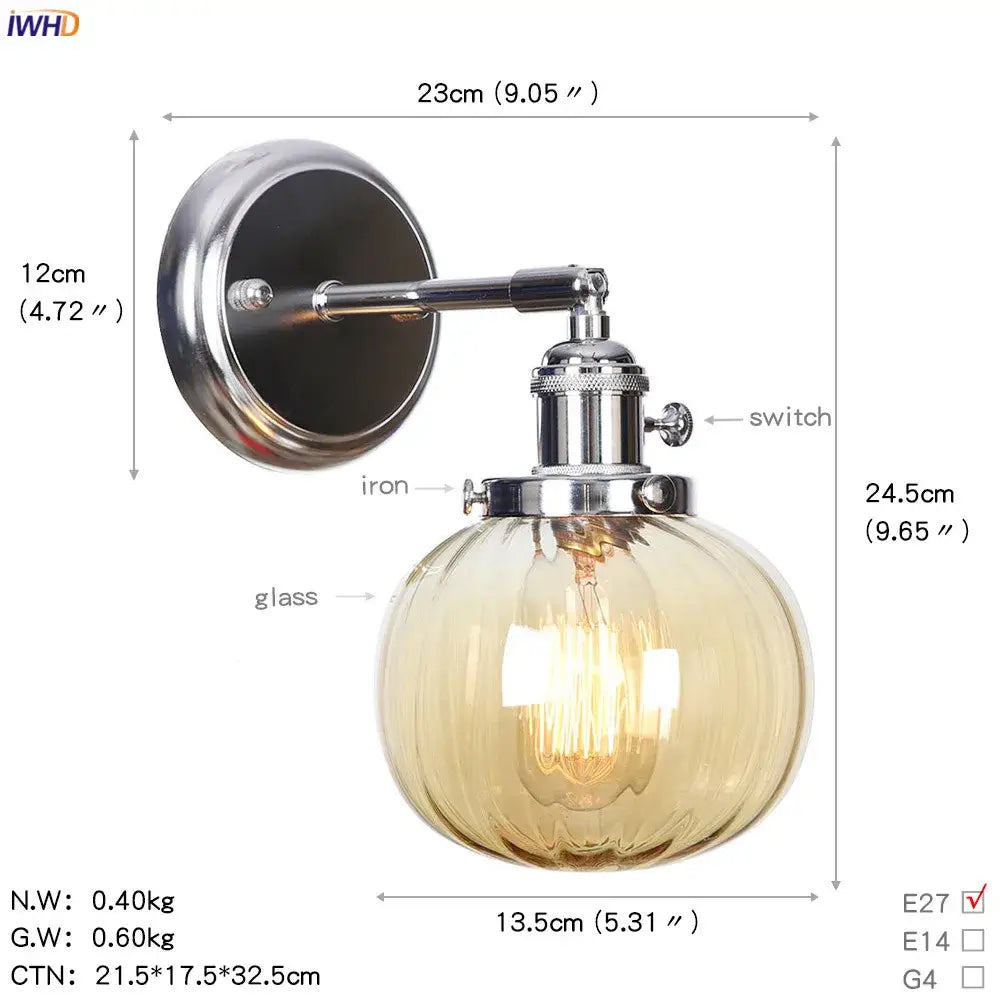 Modern chrome and amber glass ball wall light with polished iron arm and textured amber glass globe bedroom sconce