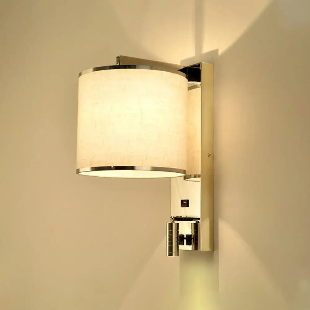 Modern chrome and beige fabric led wall sconce with cylindrical off-white shade for living room lighting
