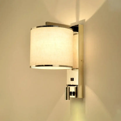 Modern chrome and beige fabric led wall sconce with cylindrical off-white shade for living room lighting
