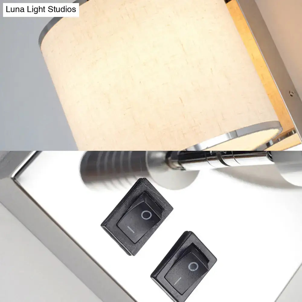 Beige fabric lampshade with a sleek chrome frame and two black toggle switches for modern living room LED wall sconce