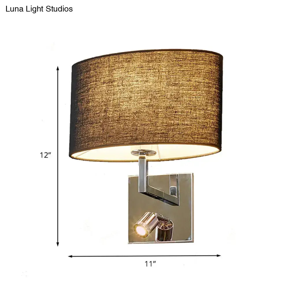 A modern wall-mounted metal fixture with a textured brown fabric shade and adjustable spotlight for bedroom use