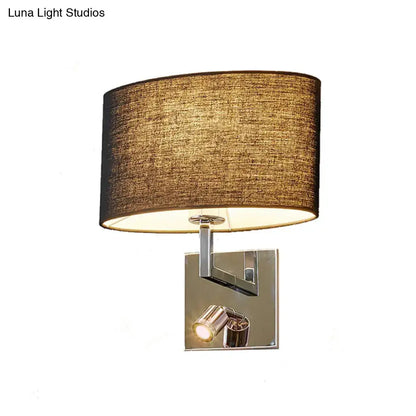 Modern chrome and brown fabric wall sconce with adjustable spotlight and metal fixture featuring a textured beige shade
