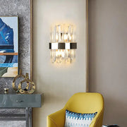 Modern chrome and clear crystal wall lamp with sleek chrome band and crystal prism accents for bedroom sconce lighting
