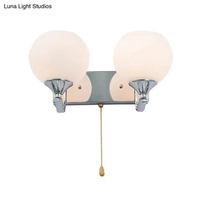 Modern chrome and cream glass wall light with two frosted globes and pull chain for 220v-240v 110v-120v use