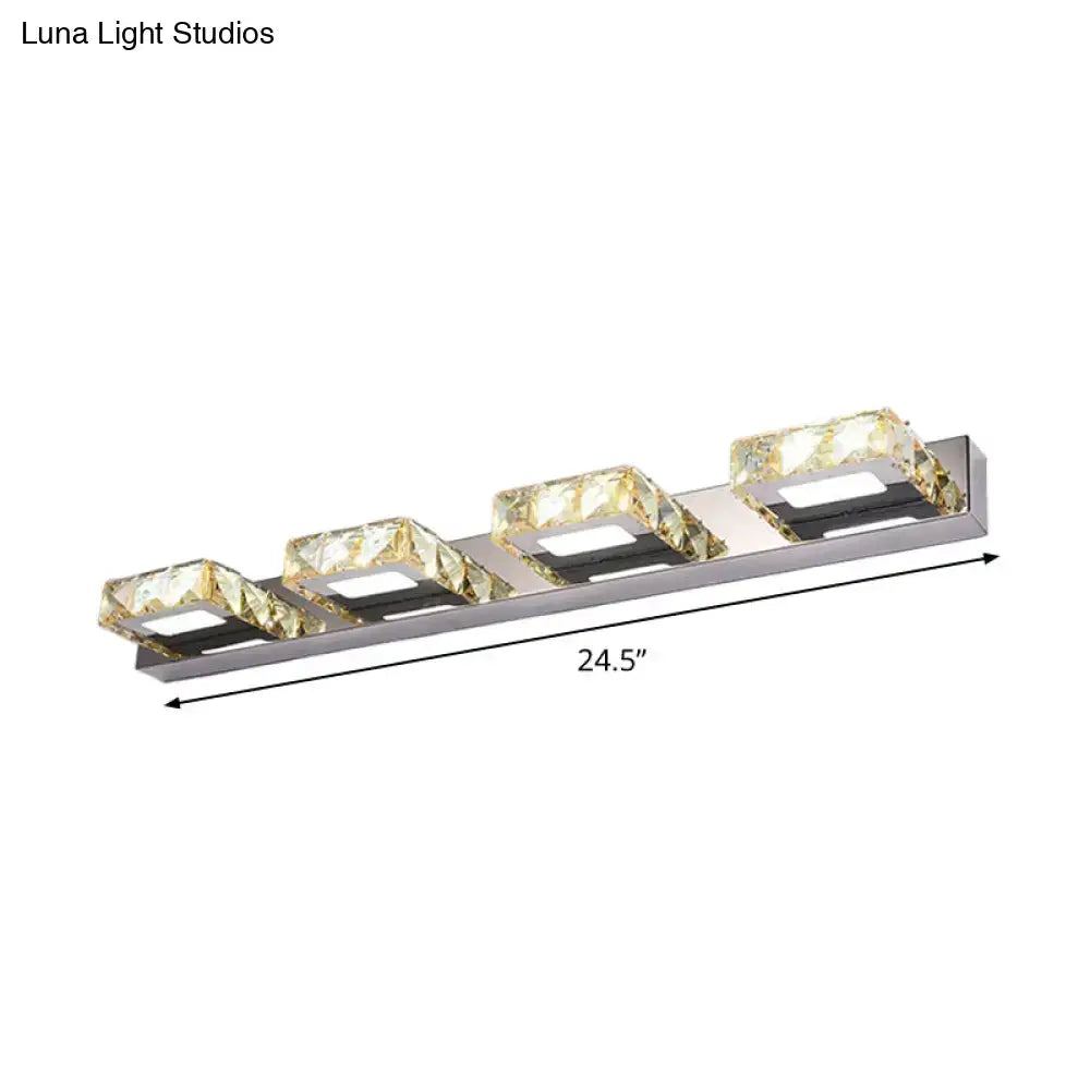Modern chrome and gold crystal vanity sconce with four faceted square lamps in stainless steel for bathroom use