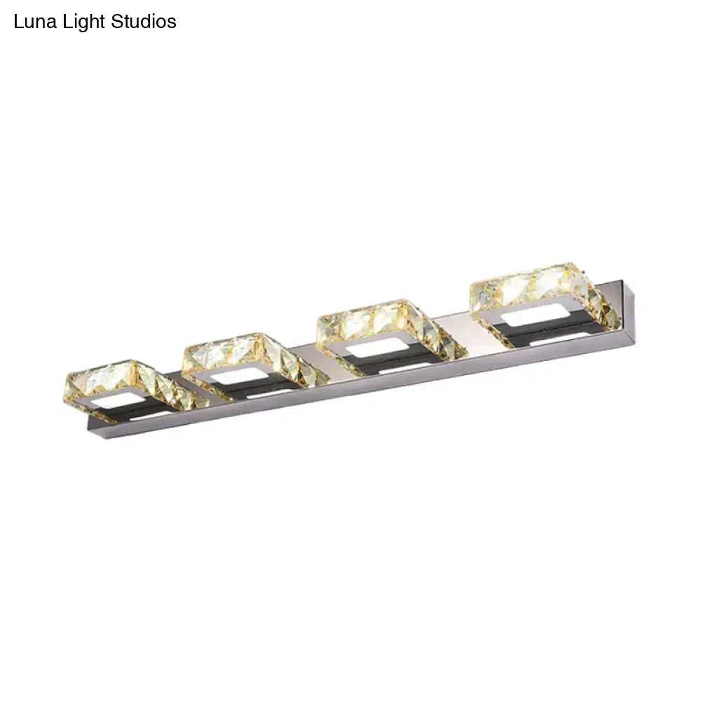 Modern chrome and gold crystal vanity sconce with four faceted golden cubes for elegant bathroom lighting